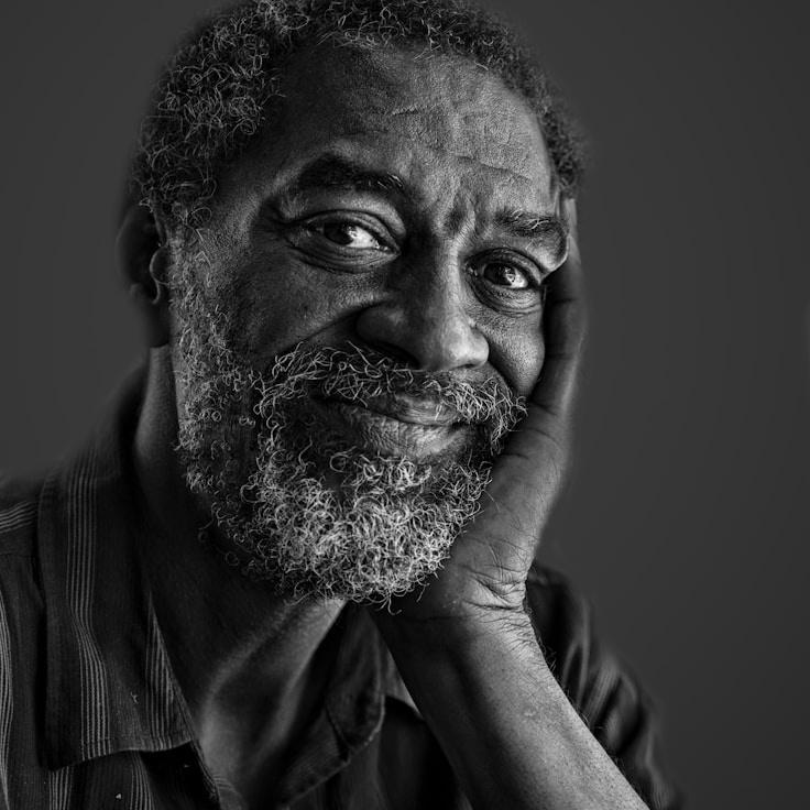 Alex Kim, Lead Design Curator at Soft Sunrise Meadow, reviewing corporate floral arrangements